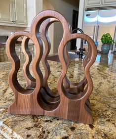 a wooden sculpture sitting on top of a kitchen counter