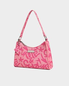 Make a bold statement with the Pink Graffiti Shoulder Bag, a playful and eye-catching accessory from Tote&Carry. This stylish shoulder bag features a vibrant pink color and a striking graffiti print, adding a touch of urban edge to any outfit. The structured design make it easy to carry, while the spacious interior provides ample room for your essentials. Pink Rectangular Shoulder Bag With Letter Print, Pink Shoulder Bag With Letter Print For Daily Use, Pink Letter Print Shoulder Bag, Trendy Pink Shoulder Bag, Trendy Pink Shoulder Bag With Letter Print, Casual Pink Shoulder Bag With Letter Print, Retro Pink Shoulder Bag For Summer, Trendy Pink Bag For Streetwear, Trendy Letter Print Shoulder Bag For Streetwear