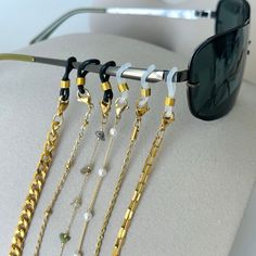 "GOLD Sunglasses Chain * Birthday Gift for Her * Mask Holder Chain * Tarnish Free Jewelry * Eyeglasses Chain for Women * Anniversary Gift Enhance your style with our versatile GOLD Sunglasses Chain, a perfect Birthday or Anniversary gift for her. This chic and functional piece doubles as a Mask Holder Chain, ensuring you stay stylish and practical. Ideal for summer and vacation, this Tarnish-Free Gold Necklace Chain seamlessly transitions from sunglasses to eyeglasses, making it a must-have accessory.  Please choose your chain style, choose your holder, and enjoy your new stylish chain necklaces! 😊  All chains come with a 2\" extender. You can customize this in the personalization box! This item is waterproof, nickel-free, and lead-free. This item is made of high-quality materials and it Adjustable Silver Glasses Chain With Chain Strap, Modern Gold Glass Jewelry, Party Metal Glasses Chains With Adjustable Chain, Adjustable Gold Glasses Chain With Strap, Modern Adjustable Gold Glasses Chains, Metal Glasses Chains As Gift, Gold Metal Glasses Chains With Chain Strap, Gold Metal Glasses Chain With Strap, Party Jewelry With Gold Chain And Glass