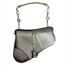 This is an CHRISTIAN DIOR Satin Crystal Mini Saddle Bag From the 2002 Collection by John Galliano. This saddle-shaped handbag is crafted of satin in light gray and features a matching strap, secured with silvertone hardwear. The front flap has a metal D initial logo and opens to a black satin Logo Jacquard Lining. This is a stylish and functional bag, with a one of a kind look, from Christian Dior! It also includes a makeup mirror. Description------------------------- Christian Dior Shoulder Bag - From the 2002 Collection by John Galliano- Vintage- Grey Satin- Graphic Print- Silver-Tone Hardware- Patent Leather Trim- Chain-Link Handle- Logo Jacquard Lining- Push-Lock Closure at Top Mini Saddle Bag, D Initial, Dior Shoulder Bag, Wallet Chains, Initial Logo, Dior Vintage, Female Style, Initials Logo, Handbag Wallet