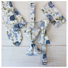 Let your look shine with Tie Mood's floral skinny neck ties with matching pre-tied bow ties and pocket squares. Our floral neck tie line offers a huge selection of flower and floral patterned ties come in various stylish colors. Color:  White and Dusty Blue Floral Imported and Handmade Material:  100% Cotton Adult Necktie: Width: approx. 2.25 in/6 cm    Length:  approx. 56 in Adult Extra Long Necktie: Width: approx. 2.25 inches  Length:  approx 63 inches Child Necktie:  Width: approx 2.25 inches Floral Bow Tie Wedding Groomsmen, Blue Floral Groomsmen, Blue Floral Tie Groomsmen, Flower Ties For Men Wedding, Floral Bow Tie Wedding, Dusty Blue Floral Tie, Light Blue Floral Tie, Blue Wedding Ties, Men’s Ties