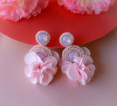 Your bridesmaids will look gorgeous wearing these Floral Circle Beaded earrings, add them to your bridesmaid's gift box or wear them yourself to attend a wedding or evening event. These seed beads embroidered flower earrings will enhance and glam up your look.These Circle Beaded Floral Rhinestone Earrings are made of seed beads embroidered rhinestones in a circular shape linked to a floral tassel.♥DETAILS + WEARINGIt will be hanging down approximately 1.75 in from your earDimensions: Approx 2.00 Circle Beaded Earrings, Light Baby Pink, Hot Pink Earrings, Floral Circle, Pink Circle, Beadwork Embroidery, Pink Studs, Bridesmaid Gift Boxes, Floral Hoops