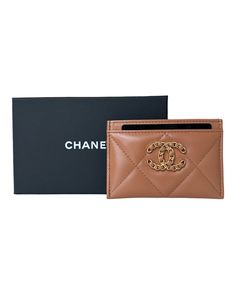 Authentic Chanel 19 Flat Card Holder, crafted from luxurious caramel lambskin leather and accented with elegant gold hardware. New, from 22A This sleek and stylish card holder measures 4.5" x 3" and is perfect for organizing your essential cards. Brand new and meticulously packaged, this item comes in its original box with a dust bag. This item is excluded from promotions & coupon codes. Luxury Tan Wallets With Interior Card Slots, Luxury Bag With Interior Card Slots And Rectangular Case, Luxury Designer Brown Card Holder, Luxury Wallets With Gold-tone Hardware, Elegant Gold Wallets For Business, Luxury Leather Wallets With Gold-tone Hardware, Luxury Brown Wallet With Logo Plaque, Luxury Wallets With Gold-tone Hardware For Business, Elegant Leather Card Holder