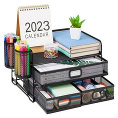 the desk organizer is organized and ready to be used as a calendar, pencils, markers