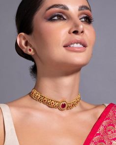 * 24K Gold Plated Handcrafted Intricate Choker Jewellery Set * Gold plated necklace, has a drawstring closure * Gold plated earrings, has a post and back closure * Size:- Necklace length: 25.3 cm Earrings length: 1.6 cm(each) *Material:- Material: Brass Plating: Gold-Plated Stone Type: CZ, Ruby stones and beads NOTE All the raw material used in this product is of high quality and is handcrafted with love. Premium Quality and High craftsmanship 100% Satisfaction Guarantee: Long Lasting Plating, H Ruby Choker Necklace, Ruby Choker, Guttapusalu Necklace, Jewellery Set Gold, Indian Jewelry Set, Choker Jewellery, Indian Choker Necklace, Indian Choker, Neck Pieces Jewelry