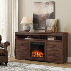 a living room with a chair and a fire place in the center, next to a couch