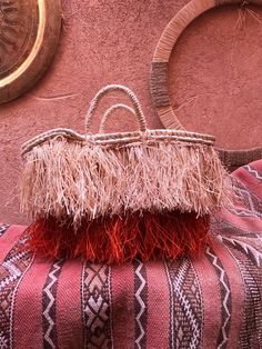 Elevate your summer style with this unique handmade straw tote bag, featuring layers of natural and vibrant red fringe. Perfect for beach days, market trips, or casual outings, this boho-inspired bag offers both functionality and flair. Crafted with care from high-quality straw, this tote bag is not only durable but also a standout accessory that complements any outfit. Material: Natural Straw, Raffia Fringe Dimensions: [Insert dimensions here] Features: Double woven handles, spacious interior, Red Basket Bag For Beach, Summer Red Straw Bag For Shopping, Red Summer Straw Bag For Shopping, Summer Style Red Straw Bag For Shopping, Natural Color Beach Bag With Fringe, Natural Fringe Beach Bag, Orange Woven Straw Bag For Beach, Red Basket Beach Bag For Summer, Red Handwoven Straw Bag For Beach