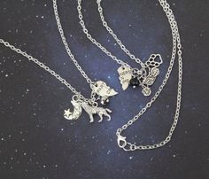 These silver charm necklaces are a magical BFF gift for you and your best friend. Featuring silver charms celebrating the Wolfstar relationship, such as a silver werewolf, dog paw print, motorcycle, moon, and more!If you're always up to no good, casting spells and causing trouble, then this necklace set is perfect for you and your 'partner in crime'.- You will receive two necklaces in your purchase: one Remus and one Sirius.- Choose from "Partners in Crime" or "Best Friends" charm options!- Choo Themed Silver Necklace For Birthday, Magical Silver Charm Necklaces As Gift, Magical Silver Charm Necklaces For Gift, Personalized Silver Charm Necklace, Silver Pendant Charm Necklace With Magical Style, Silver Pendant Charm Necklace For Best Friend, Silver Nickel-free Charm Necklace For Friendship, Silver Werewolf, Sirius Remus