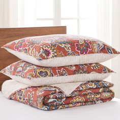 three pillows stacked on top of each other