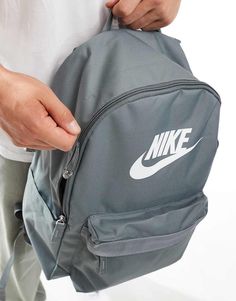 Accessories by Nike Bagging compliments Grab handle Padded and adjustable straps Padded mesh back Drawstring closure with buckle details External zip pockets Nike branded details Heritage Logo, Nike Brand, New Nike, Grey Fashion, Zip Pockets, Adjustable Straps, Asos, Buckle, Backpacks