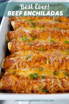 an enchilada dish with cheese and green onions on top, in a white casserole dish