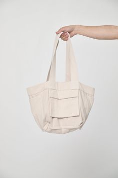 The perfect shoulder-strapped companion for any adventure. This tote is well-proportioned and reversible, with four useful pockets which can be inside or flipped for easy access. Made from a unique blend of recycled scraps and sustainably sourced cotton, developed in partnership with a family factory in Colombia that supports a fair-wage workforce and closed-loop supply chain. Details Unisex Great as a weekender or carry-on bag Reversible, with internal or external pockets 9.5 oz Woven Bull Deni On-the-go Hobo Bag With Pockets, Everyday Utility Bag With Removable Pouch, Utility Shoulder Bag With Multiple Pockets For Everyday, Utility Shoulder Bag With Functional Pockets For Everyday, Everyday Tote Shoulder Bag With Pockets, Everyday Double Handle Shoulder Bag With Pockets, Everyday Shoulder Bag With Double Handle And Pockets, Utility Bags With Multiple Pockets For Everyday Use, Utility Bags With Functional Pockets For Everyday Use