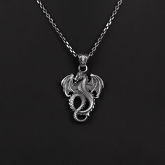 Winged Dragon Silver Man Necklace, Mens Dragon Pendant With Chain, Oxidized Silver Dragon Gift Pendant, Medieval Dragon Silver Men Pendant *  Item Details * Gender : Male / Female * Material : 925 Sterling Silver * Pendant Weight : 5 Grams * Chain Length 18 Inches - (45cm)  20 Inches - (50cm)  22 Inches - (55cm)  24 Inches - (60cm)  26 Inches - (65cm)  28 Inches - (70cm)  ✔ Ready to Ship in 1-3 Business Days ✔ Shipped to the worldwide 1-5 business days with free shipping. ✔ The product will be s Collectible Black Stainless Steel Necklace, Collectible Silver Necklace With Dragon Design, Male Necklace, Necklace Dragon, Winged Dragon, Man Necklace, Medieval Dragon, Men Pendant, Wings Pendant