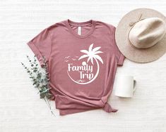 Family Trip Tee Shirt, Matching Friends Vacation Shirt, Family Beach Shirts, Palm Tree Shirts, 2023 Summer Vacation Shirts for Family  PREMIUM T-SHIRT FEATURES ✔️ Short Sleeve, Crew Neck, Super Soft Bella Canvas T-Shirt ✔️ 100% Combed and Ring-Spun Cotton (Heather Colors Contain Polyester) ✔️ Shoulder-to-Shoulder Taping ✔️ Side-seamed ✔️ Safe to Machine Wash and Tumble Dry on Low ✔️ Design is High Quality Permanently Printed ✔️ Made, Printed and Shipped from The USA Summer Crew Neck Tops For Family Vacation, Casual Letter Print Shirt For Family Vacation, Casual Shirt With Letter Print For Family Vacation, Summer Family Vacation Shirt With Short Sleeves, Casual Cotton Tops For Family Vacation, Casual Relaxed Fit Shirt For Family Vacation, White Shirt For Family Vacation In Summer, White Shirt For Family Vacation And Summer, Summer Family Vacation Shirt With Graphic Print