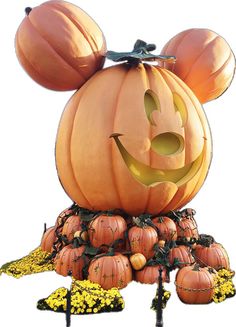 a mickey mouse pumpkin with its face carved into it