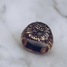 Antiqued gold brass ring with a floral rose engraving. This women's or men's gold brass ring has a beautiful signet style. The rose has ancient symbolic meaning including love, beauty and timelessness. Available in Sterling Silver: https://etsy.me/2RAJ6vD Ring Size Available in all sizes. Please be sure to find your exact ring size for the finger you want before ordering. See image chart above or you can use the chart on my website as a guide - https://jewelrylab.co/pages/ring-sizing-tips A note Antique Gold Ring, Rose Rings, Signet Ring For Men, Signet Ring Gold, Antique Gold Rings, Mens Pinky Ring, Gold Pinky Ring, Rustic Rings, Gold Signet Ring