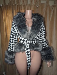 This Houndstooth Poncho from Primadons and Donnas is an oversized faux fur coat with a hood. It is made of a first class quality faux fur fabric, available in many colors. Soft and romantic, this style of coat is perfect for any occasion, from parties to traveling to shopping. The size of the poncho is 180cm*75cm. If you would like to customize the color, please choose the 'custom color' option and place the color you want in the order notes. Chic Hooded Fur Coat With Faux Fur Trim, Winter Faux Fur Coat With Feather Trim, Fall Faux Fur Hooded Coat, Fall Hooded Faux Fur Coat, Fall Outerwear With Faux Fur Trim, Fall Fur Coat With Feather Trim For Cold Weather, Fall Faux Fur Outerwear With Feather Trim, Fall Faux Fur Coat With Faux Fur Trim, Faux Fur Outerwear With Feather Trim For Cold Weather