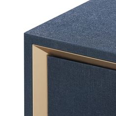 a close up view of the side of a blue and gold cabinet with two doors