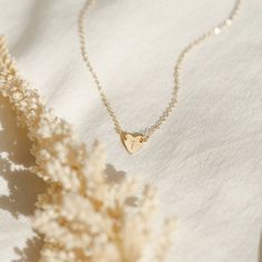 "Initial your heart with the one you love (or leave it blank)! This piece is about as cute and subtle as it gets--the perfect choice if you're looking for a meaningful necklace that will fit right into your everyday lineup. Every piece is handcrafted and hand-personalized with love in La Conner, WA, using 90% recycled and 100% ethically sourced raw materials from the USA--because it's better that way. Includes free gift-ready packaging (featuring a care card and traditional letterpress goodies made by my dad)!  MATERIALS: * Gold = 14k gold filled * Silver = sterling silver * Rose gold = 14k rose gold filled DETAILS: * 6x7mm heart * Hand-personalized with traditional metal punches AT CHECKOUT: * If you chose \"other\" for length, specify which length you'd like in a note.  * Select expedite Heart Necklace With Initial, Gold Heart Initial Necklace, Delicate 14k Gold Filled Heart Necklace For Valentine's Day, Delicate 14k Gold Filled Heart Necklace For Everyday, Minimalist 14k Gold Filled Heart Necklace As Gift, Personalized Minimalist Heart Necklace For Everyday, Everyday Delicate Heart Necklace For Mother's Day, Dainty Heart Pendant Initial Necklace For Everyday, Everyday Dainty Heart Pendant Initial Necklace