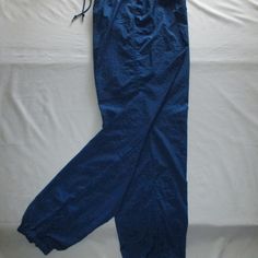 Nike Leisure Pants - Royal Blue - (M 8-10) Nwot Nike Leisure Pants With Drawstring Elastic Waist, Zipper On Each Lower Leg With Elastic Hem, Three (3) Pockets; One On Each Side With An Additional Tab Velcro Inner Pocket To Secure Keys, Cash, And I.D.; Can Be Worn Over Swim/Workout. Size M/8-10. Approx. Measurements Are: 25 ¼” Around/Diameter Without Elastic Stretch, Stretch To 16” Flat (32”), Hips 22” Flat (44”), Inseam 31 ½”, Ankle Zipped With No Stretch 10 ¼” Around/Diameter, Zipper On Leg 12” Stretch Blue Cotton Cargo Pants, Blue Stretch Cotton Cargo Pants, Blue Stretch Straight Leg Cargo Pants, Blue Stretch Cargo Pants For Spring, Blue Cargo Pants With Elastic Waistband And Tapered Leg, Blue Stretch Wide Leg Cargo Pants, Blue Tapered Leg Cargo Pants With Elastic Waistband, Nike Tapered Leg Bottoms With Pockets, Stretch Blue Bottoms With Pockets