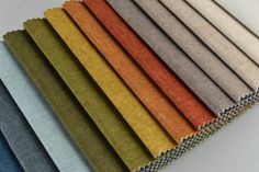 the colors of fabric are arranged in rows