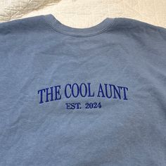 a blue shirt that says the cool aunt estt 2012 on it's chest