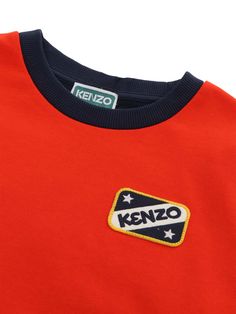 Bicolour sweatshirt in fleece (85% cotton / 15% polyester), front of the sweatshirt in red and back in navy, embroidered badges on the front and on the sleeves, embroidered badge KENZO PARIS on the back.Composition: 95% COTTON 5% ELASTANE FABRIC 2 85% COTTON 15% POLYESTER Playful Red Cotton Sweatshirt, Toddler Boy Red Sweater, Collegiate Long Sleeve Red T-shirt, Kenzo Tshirt, Kenzo Tiger Sweatshirt, Embroidered Badges, Barbour Steve Mcqueen, Kenzo Kids, Steve Mcqueen