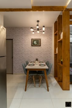 a dining room with a table and chairs in front of a brick wall that has been built into the ceiling