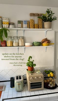 a kitchen with white tile counter tops and shelves filled with food on top of it