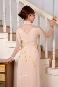 Elegant Fitted Gown With Intricate Embroidery, Festive Wedding Ao Dai With Floral Embroidery, Elegant Wedding Dresses With Embroidered Sleeves, Elegant Ao Dai With Floral Embroidery, Elegant Embroidered Dresses For Ceremony, Intricate Embroidery Ao Dai For Wedding, Ceremony Fitted Embellished Dress, Long Sleeve Floral Embroidery Dress For Ceremony, Elegant Floral Embellished Festive Dresses