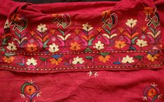 This is a jacket made of hand spun cotton naturally dyed in a rich madder hue probably from Sindh in Pakistan. It is decorated with silk embroidered flowers and bird motifs in naturally dyed silk. It was likely made from a larger textile and reformed into a jacket. It has traditionally made mirrors by local artisans and sewn into various areas of the textile. This is a very unique and beautiful garment and perfectly wearable. One of a kind. -Shoulder width: 66 cm, Sleeve length: 52 cm, Top to bo Kalamkari Blouse Designs, Kalamkari Blouse, Border Embroidery Designs, Indian Bridal Dress, Border Embroidery, Bird Motif, Dyed Silk, Silk Embroidery, Silk Dyeing