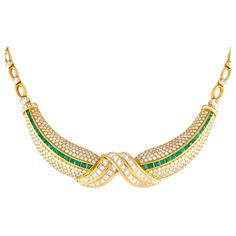 Prepare to be impressed by the elegance of this exceptionally luxurious collar necklace. It is expertly crafted in rich 18K yellow gold and finely detailed with 11 carats of diamonds and 3.85 carats of vibrant green emerald gemstones. The necklace measures 12 inches long and is fastened by a secure box tab clasp.Offered in estate condition, this 18K Yellow Gold 11.0ct Diamond and 3.85ct Emerald Necklace comes with a gift box. Luxury Handmade Yellow Gold Emerald Necklace, Luxury Yellow Gold Emerald Necklace For Celebration, Luxury Hand Set Emerald Necklace In Yellow Gold, Luxury Faceted Yellow Gold Emerald Necklace, Luxury Yellow Gold Teardrop Emerald Necklace, Multi Sapphire, Emerald Necklace, Yellow Gold Setting, Gold Brooches