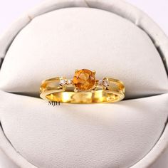 "Handmade Gemstone: Natural Citrine This ring features a Round cut Natural Citrine and 925 sterling silver finished with Gold rhodium. It is made by hand. Product Description Main stone: Natural Citrine Metal type: 925 sterling silver finished with Gold rhodium Rhodium nickel free Made In : Jaipur Rajasthan Payment Policy------------------------------ we accept payment through PayPal only, Payment should be made within 3 days of purchase. .Delivery Time------------------ Item will be Shipped Wit Peridot Jewelry Rings, Halo Ring Engagement, Yellow Gemstone Ring, Ametrine Ring, March Birthstone Ring, Green Gemstone Ring, Citrine Jewelry, Peridot Jewelry, Yellow Gemstones