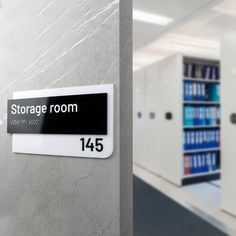 there is a sign on the wall that says storage room, in front of some shelves