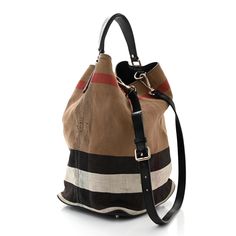 This is an authentic BURBERRY Canvas Mega Check Medium Ashby Hobo in Black. This chic tote is crafted of a Burberry oversized check canvas. The bag features a tall looping, end to end black calfskin leather strap handle with polished aged silver links, an optional leather shoulder strap with aged silver clasps and a full leather base. The top opens to a matching fabric interior with a removable hanging zipper pocket. Zipper Pocket, Calf Skin, Leather Straps, Burberry, Shoulder Strap, Zipper, Canvas, Leather, Silver