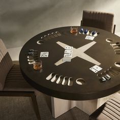 a table that has some cups on it and a clock in the middle with numbers