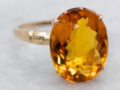 This citrine solitaire ring features a bold color! The gemstone is a saturated golden orange and sparkles beautifully against the warmth of the yellow gold mounting. Simple in style, this ring has a timeless design! Metal: 14K Yellow Gold, 18K Yellow GoldGem: Citrine 5.86 CaratsGem Measurements: 11.0 x 14.3 mm, OvalRing Size: 6.75Marks: "14K-18K G" Stamped on the inside band Yellow Topaz Ring, Classic Gold, Bold Color, Topaz Ring, Color Themes, Cocktail Rings, Solitaire Ring, Aesthetic Art, Citrine