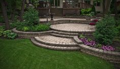 an outdoor patio with steps and landscaping