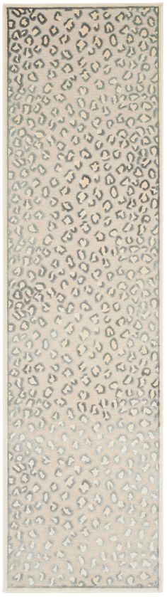 a rug with an animal print pattern on the front and back of it, in grey tones