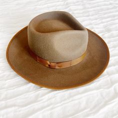 Gigi Pip Monroe Rancher Felt Fedora Hat. Size: 55 Xs Color: Brown New Without Tags. The Monroe Rancher Is A Hat With A Teardrop Shaped Crown, Stiff Upturned Brim, And Is Paired With A Tonal Grosgrain Band. These Beautiful Combinations Make This Felt Fedora Hat A Classic. Product Details 100% Soft Australian Wool. Teardrop Rancher Crown. Classic Crown Height. Stiff Medium Upturned Brim. Grosgrain Trimmed Brim. Coordinating Grosgrain Band Included. Great Sun Protection. Casual Solid Hat Bands With Flat Crown, Retro Brown Wide Brim Fedora, Casual Brown Fedora With Flat Crown, Retro Wide Brim Fedora For Fall, Brown Hat Bands For Winter, One Size Fits Most, Retro Brown Hat Bands For Winter, Fitted Brown Felt Hat Casual, Fitted Brown Felt Hat Casual Style, Brown Fitted Casual Felt Hat