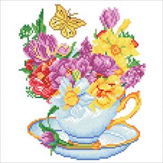 a cross stitch pattern with flowers in a teacup and butterfly on the side,