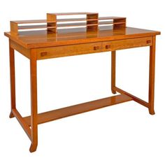 a wooden desk with two drawers on it