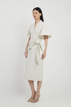 Tailored Metallic Angel Sleeved Midi Pencil Dress | Karen Millen Chic Short Sleeve Belted Dress For Office, V-neck Belted Midi Dress For Office, Belted Midi Length Wrap Dress For Spring, V-neck Midi Dress With Structured Shoulders For Work, Midi Length Belted Wrap Dress For Spring, Spring Formal Dress With Cape Sleeves, Chic V-neck Wrap Dress For Office, Elegant Workwear Dresses With Tie Sleeves, Fitted Midi Dress With Cape Sleeves For Spring