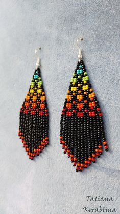 Handmade Colorful Beaded Drop Earrings, Traditional Multicolor Beaded Fringe Chandelier Earrings, Handmade Colorful Beaded Dangle Earrings, Colorful Handmade Beaded Dangle Earrings, Multicolor Dangling Beads Drop Earrings, Handmade Multicolor Dangle Beads, Bohemian Orange Beaded Earrings With Black Beads, Multicolor Handmade Dangle Beaded Earrings, Handmade Multicolor Beaded Dangle Earrings