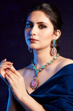 Elegantly blending classic and contemporary styles, this necklace set exudes a timeless and regal presence that is sure to capture attention. Perfect for any special occasion, its combination of traditional charm and modern elegance makes it the perfect accessory to elevate your ensemble. Finish: 22KT Gold Plating Material: Silver, Copper Alloy, Polki, Crystals Color: Multicolored Size: Free Size, Adjustable Closure Type: Draw String Box Contains: 1 Necklace, 1 Pair Earrings Hand Jewelry Rings, Chain Braid, Artificial Jewelry, Jewelry Indian, Hand Jewelry, Stone Design, Anklet Jewelry, Charm Gift, Gold Pearl