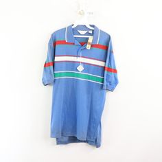 Vintage 80s Striped Color Block Short Sleeve Polo Shirt Polo Shirt New With Tags Mens Size Large Measurements Are: 22 Inches Underarm To Underarm 27 Inches Top To Bottom Blue Striped Cotton Check Out My Other Items In My Store! T283 Retro Blue Collared Top, Blue Retro Collared Tops, Blue Collared Retro Tops, Retro Short Sleeve Polo Shirt For Spring, Retro Spring Polo Collar Tops, Vintage Blue Collared T-shirt, Vintage Blue Polo Shirt, Retro Blue Polo Collar T-shirt, Blue Retro Short Sleeve Tops