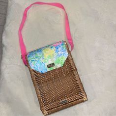 New Lilly Pulitzer Lined Picnic Basket Bag. Pink Adjustable Shoulder Strap, Gold Hardware, Two Vertical Line & Padded Sections, Perfect For Two Bottles Of Wine. The Exterior Is Rattan With A Lilly Pulitzer Fabric Flap And Gold Buckle. Measures 13.5” High & 10” Wide. The Gold Metal Lilly Pulitzer Label Still Has The Clear Protective Plastic Covering On It Preppy Travel Bags For Spring, Preppy Spring Travel Bags, Casual Pink Picnic Bags, Lilly Pulitzer Fabric, Basket Bag, Picnic Basket, Lilly Pulitzer, Gold Hardware, Gold Metal