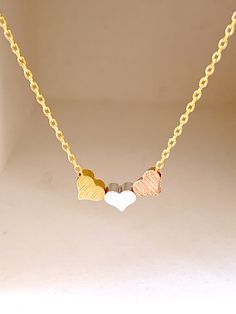 "Beautiful simple and everyday necklace~ Please write a note your initial \"note to seller box\" when you check out if you choose initial. DESCRIPTION: - This listing is for the HEART necklace. / 3 mini heart size 5mm - 16K gold, rose gold, silver over brass chain and lobster clasp - Handcrafted in the USA and beautifully packaged for you. LENGTHS: about 16 inch" Valentine Gifts For Girls, Tiny Heart Necklace, Antler Necklace, Girl Necklace, Gift For Best Friend, Personalized Mother's Day Gifts, Buddha Pendant, Gift Valentine, Diamond Bar