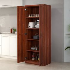 an open cabinet in the middle of a kitchen