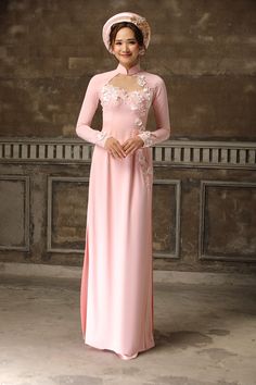 Traditional collar Fabric: Crepe, 3D flowers Raglan long sleeves Type: Modern ao dai Elegant Pink Ao Dai With Floral Embroidery, Traditional Long Sleeve Ao Dai For Banquet, Elegant Ao Dai With Floral Embroidery For Festive Season, Elegant Long Sleeve Cheongsam With Floral Embroidery, Traditional Long Sleeve Evening Gown, Festive Long Sleeve Gown For Ceremonies, Fitted Long Sleeve Gown With Floral Applique, Elegant Long Sleeve Gown With Floral Applique, Fitted Long Sleeve Ao Dai For Ceremony